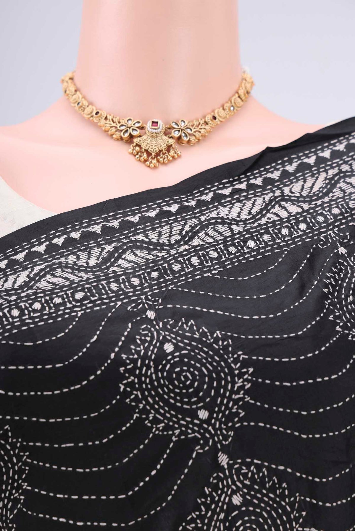 Border image of Black Kantha Silk Saree with Kantha Work on the body and Thread Border. 