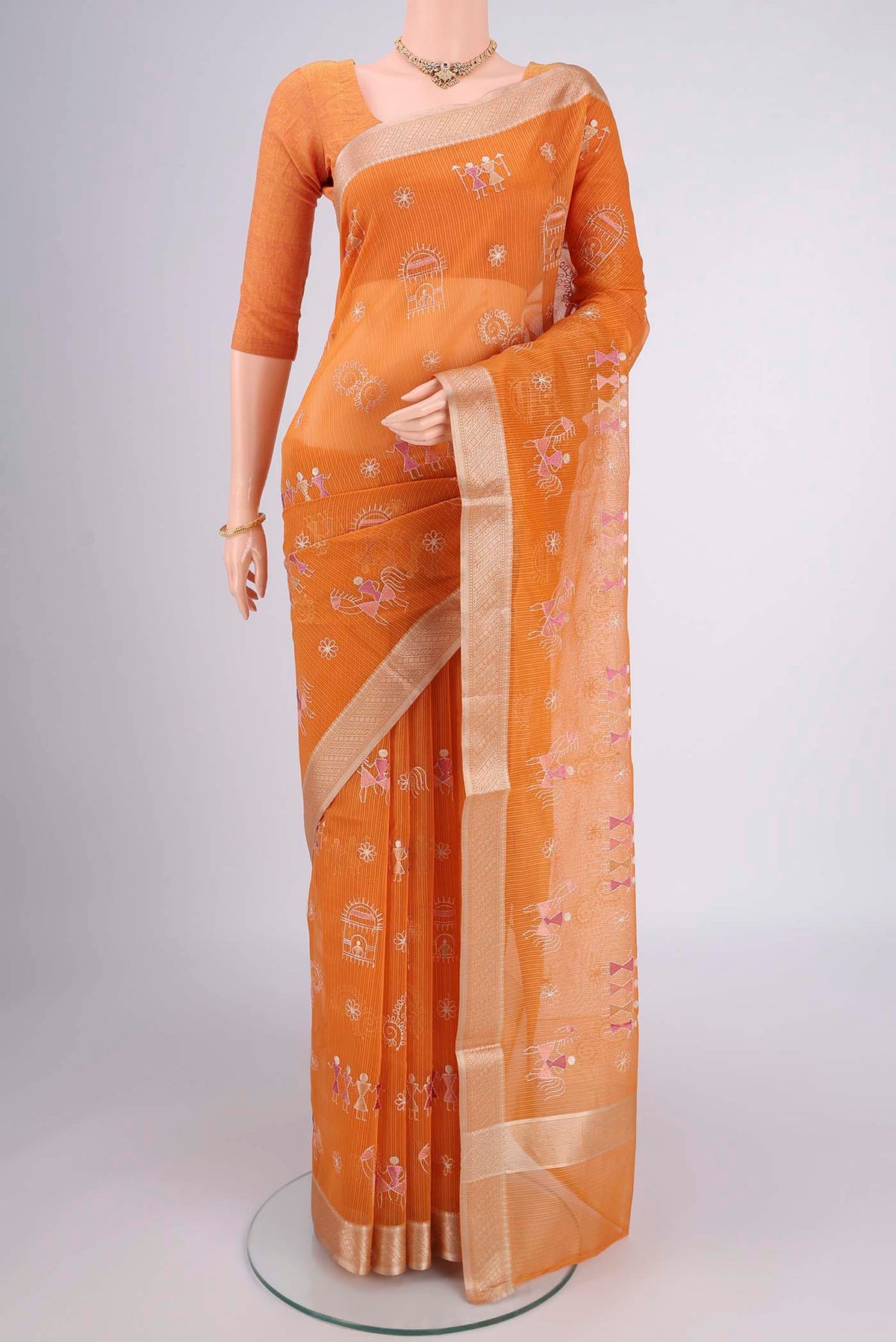 Brick Orange Dual Tone Blended Kota Cotton Saree with Embroidery on the body and Zari Border.  displayed on a mannequin