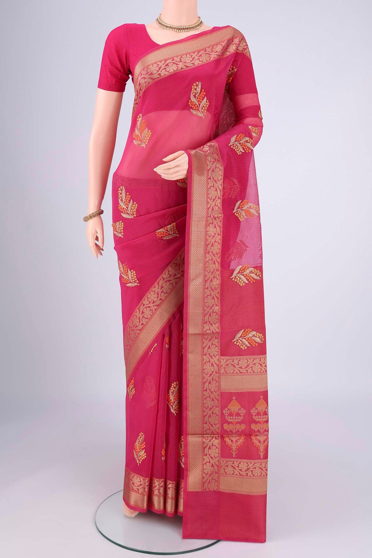 Rani Pink Blended Kota Cotton Saree with Embroidery on the body and Thread Border.  displayed on a mannequin