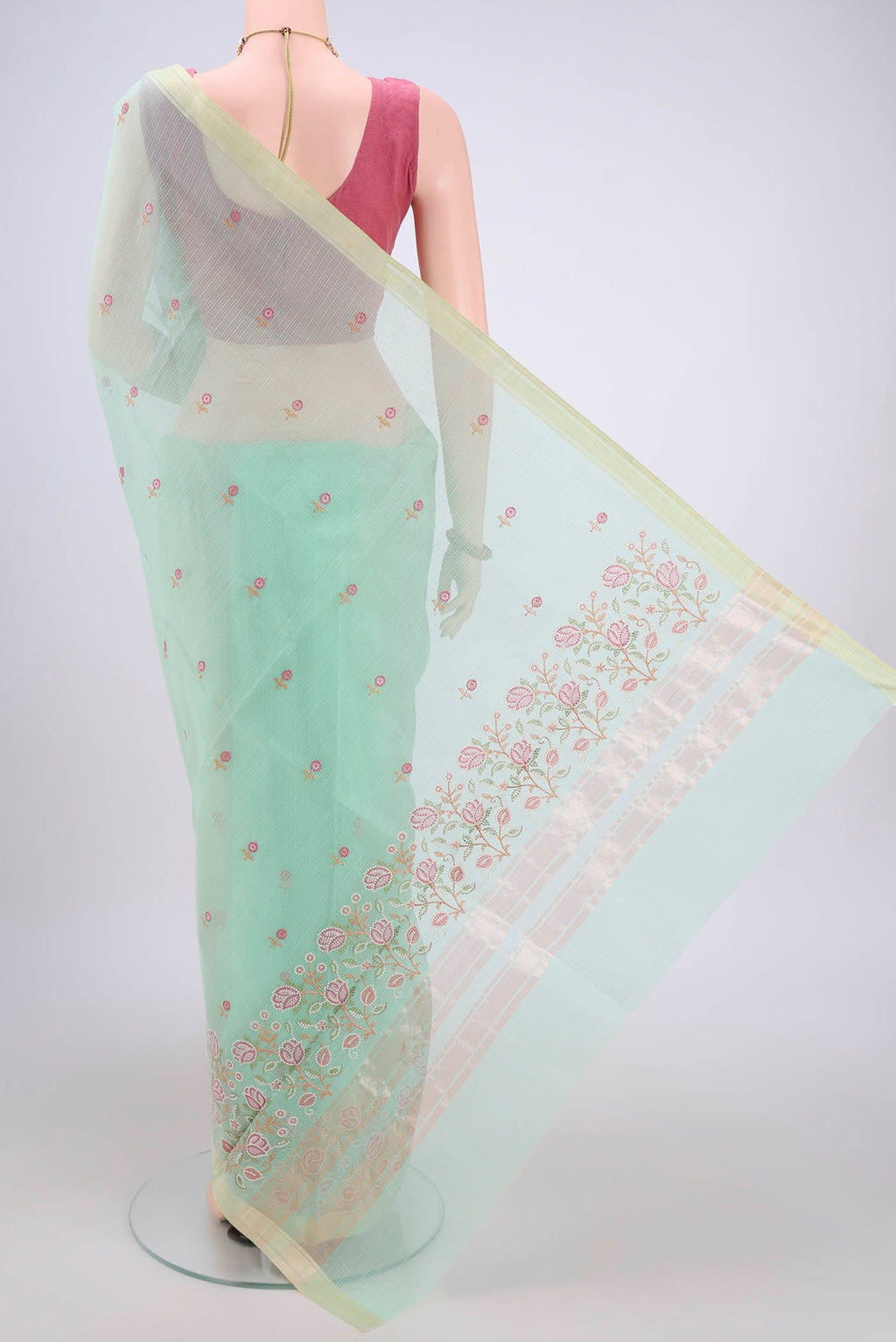 Flat view of Mint Green Blended Kota Cotton Saree with Embroidery on the body and Zari Border. 
