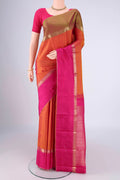 Brick Orange Dual Tone Kanchipuram Silk Saree with Zari Butta on the body and Ganga Jamuna Border.  displayed on a mannequin