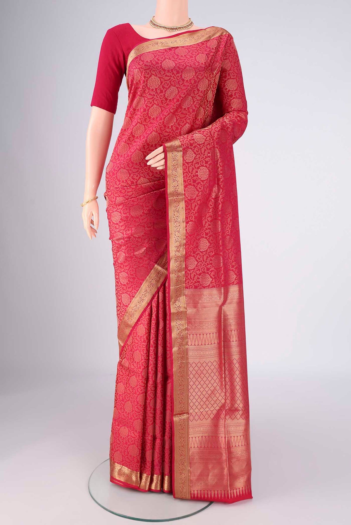 Dark Pink Soft Silk Saree with Zari Brocade on the body and Zari Border.  displayed on a mannequin