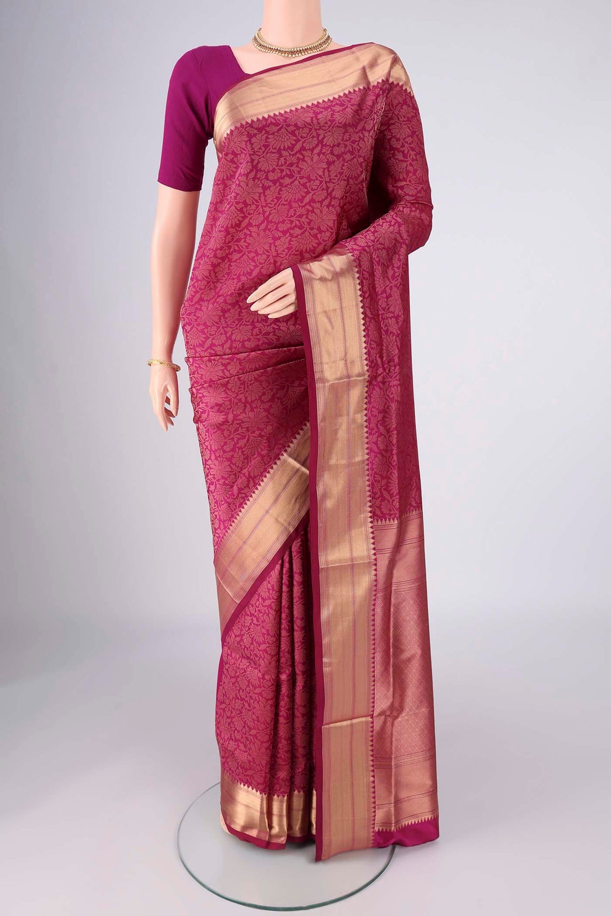 Magenta Soft Silk Saree with Zari Brocade on the body and Zari Border.  displayed on a mannequin