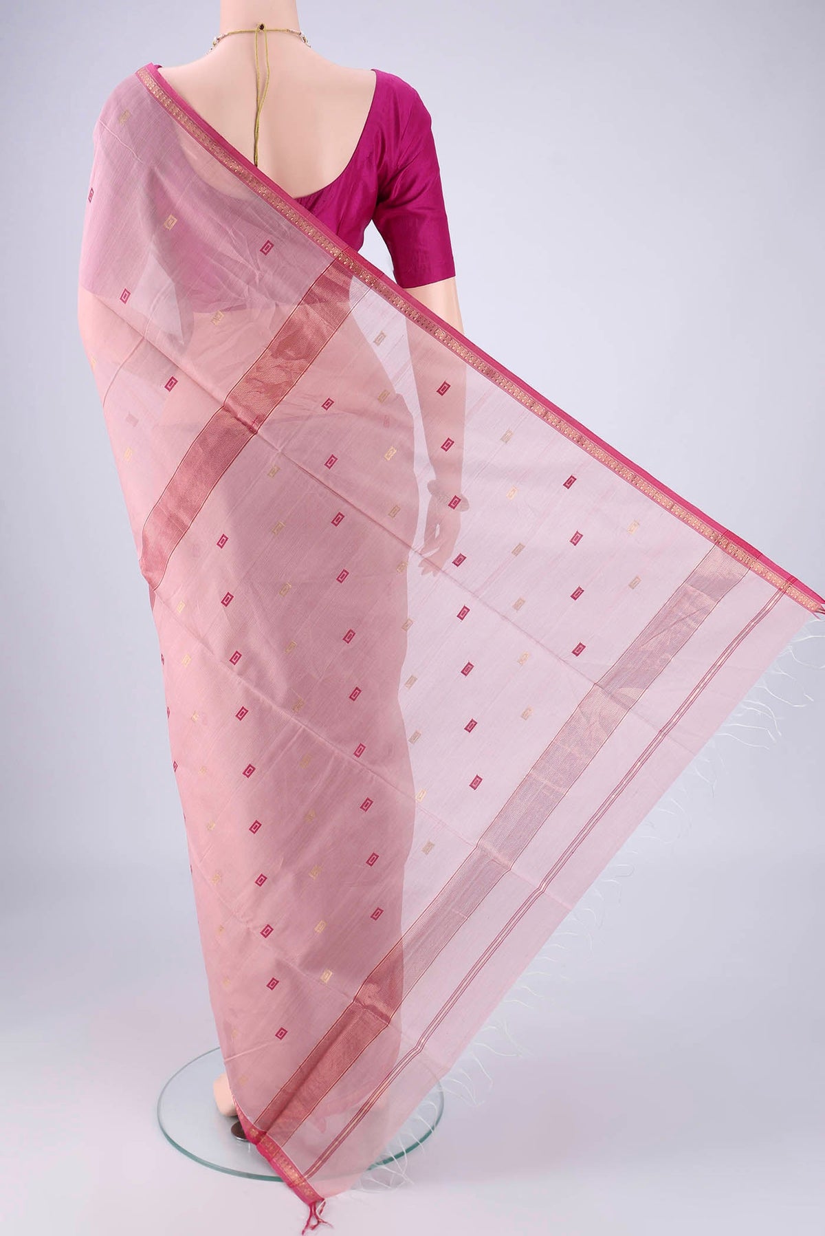 Flat view of Rose pink Maheshwari Silk Cotton Saree with Zari And Thread Butta on the body and Zari Border. 
