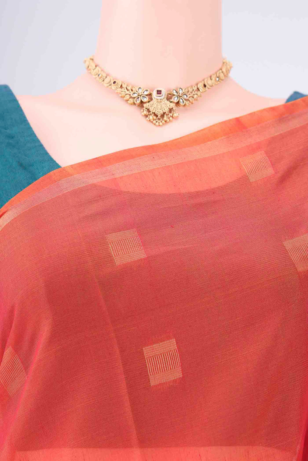 Border image of Orange Kora Cotton Saree with Zari Butta on the body and Plain Border. 