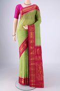 Light Green Gadwal Silk Cotton Saree with Zari Butta on the body and Silk Border.  displayed on a mannequin