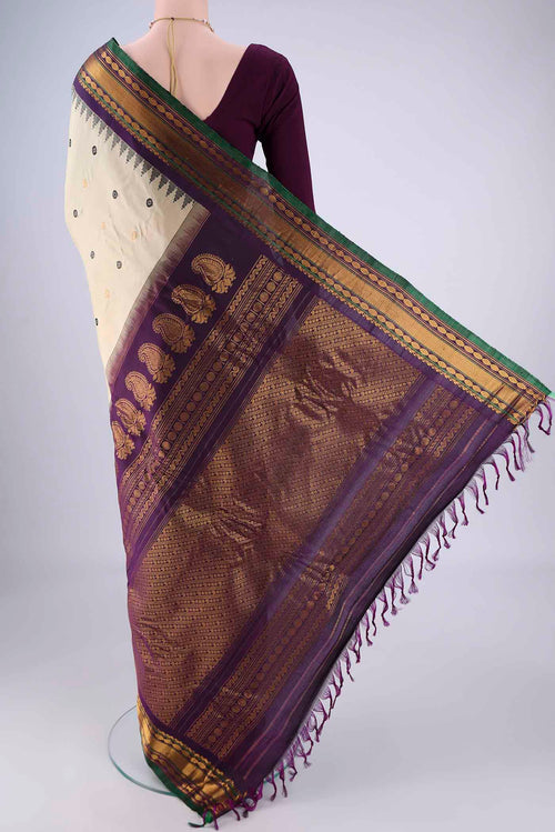 Flat view of Beige Gadwal Silk Saree with Zari Butta on the body and Zari Border. 
