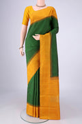Green Kanchipuram Silk Saree with Checked design on the body and Zari Border.  displayed on a mannequin