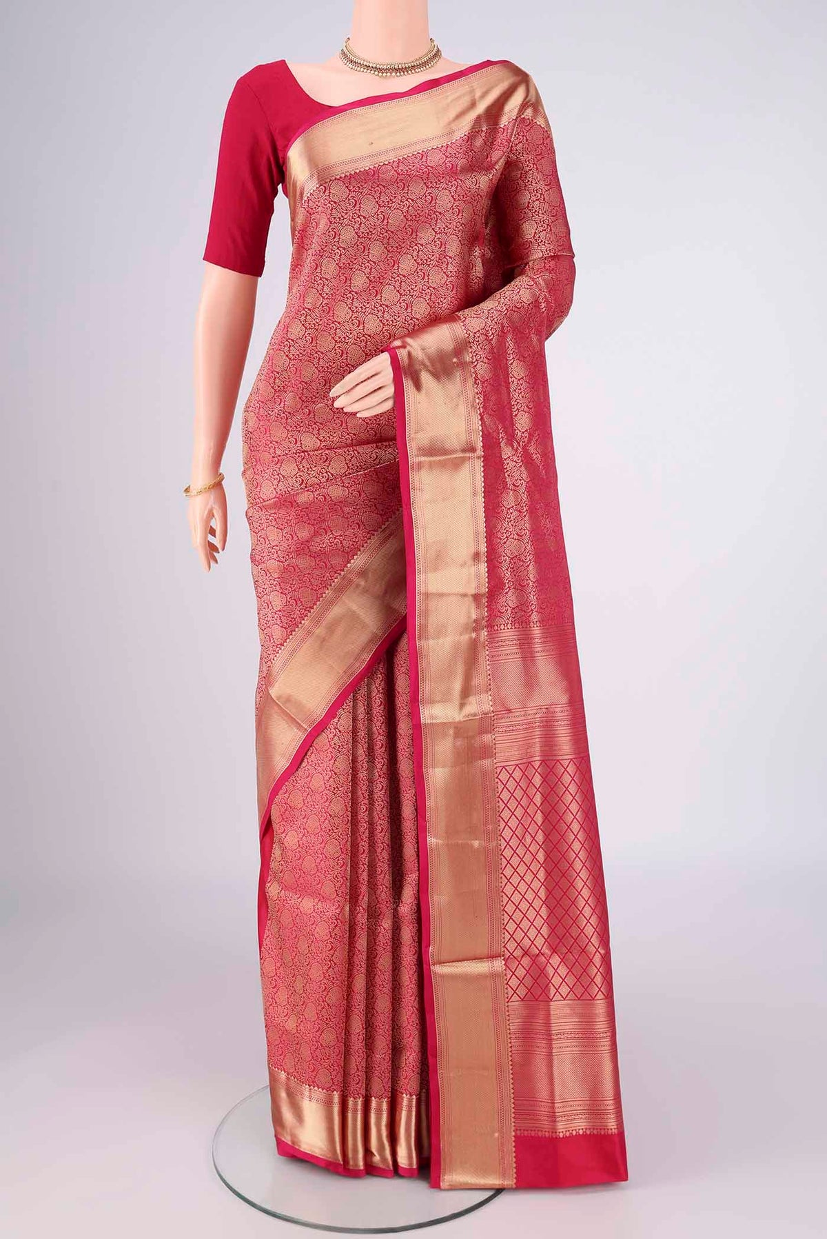 Rani Pink Soft Silk Saree with Zari Brocade on the body and Zari Border.  displayed on a mannequin