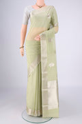 Mint Green Chanderi Silk Cotton Saree with Zari Butta on the body and Zari Border.  displayed on a mannequin