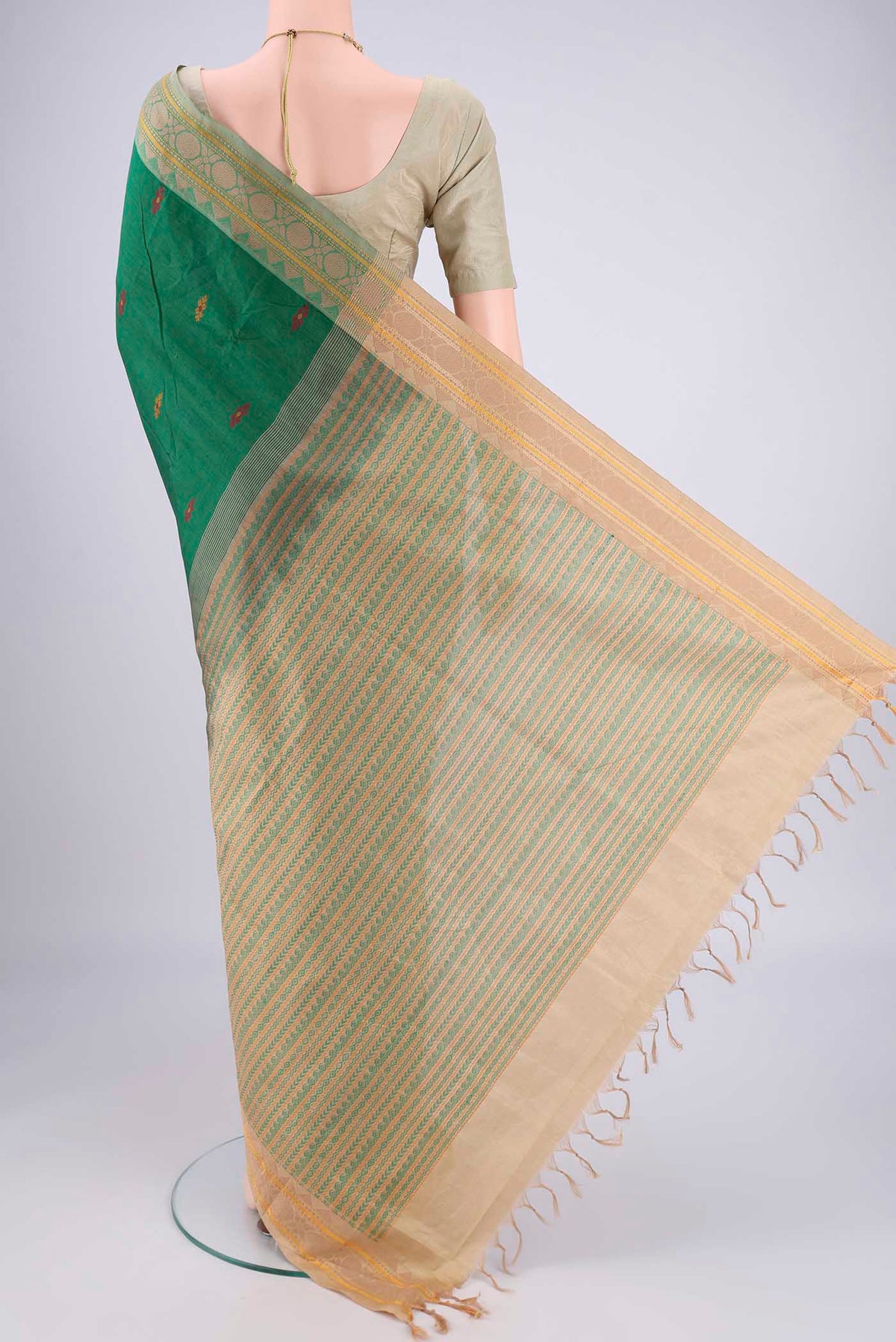 Flat view of Bottle Green Blended Poly Cotton Saree with Thread Butta on the body and Thread Border. 
