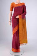 Magenta Blended Poly Cotton Saree with Stripes on the body and Thread Border.  displayed on a mannequin