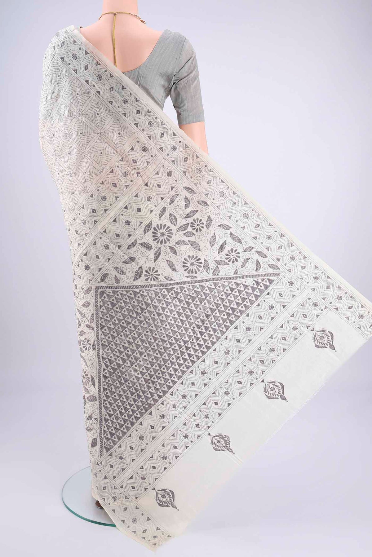 Flat view of White Kantha Silk Saree with Kantha Work on the body and Thread Border. 