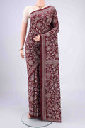 Maroon Kantha Silk Saree with Kantha Work on the body and Thread Border.  displayed on a mannequin