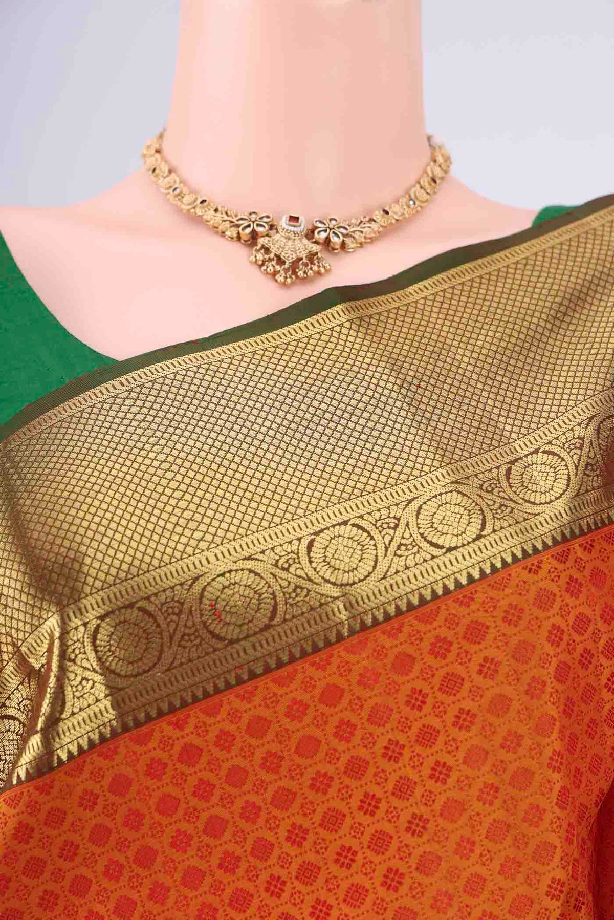 Mustard Dual Tone Kanjivaram Saree with Jacquard design on the body and Zari Border.  displayed on a mannequin