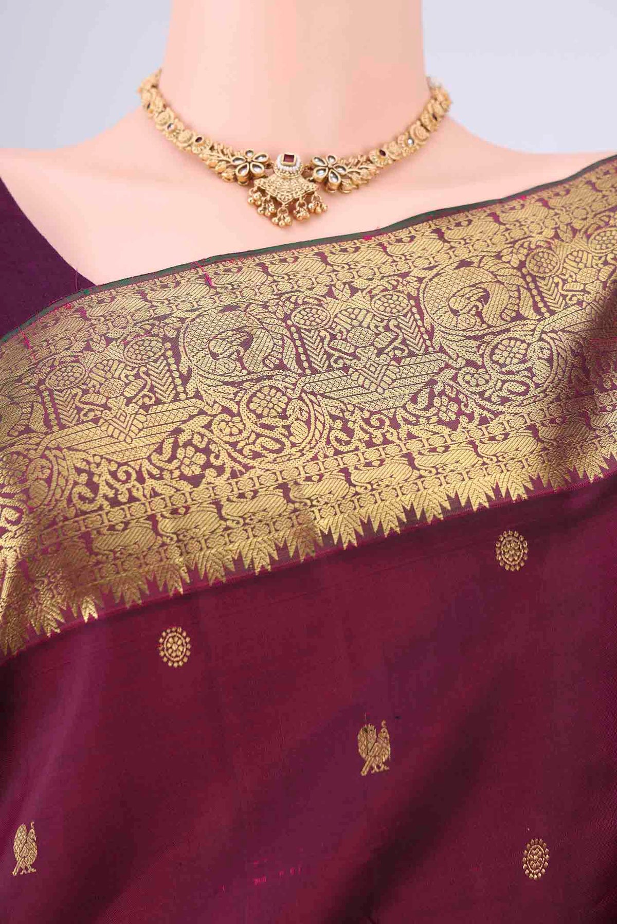 Border image of Pure Silk Pure Zari Maroon Kanchipuram Saree with Zari Butta on the body and Zari Border. 