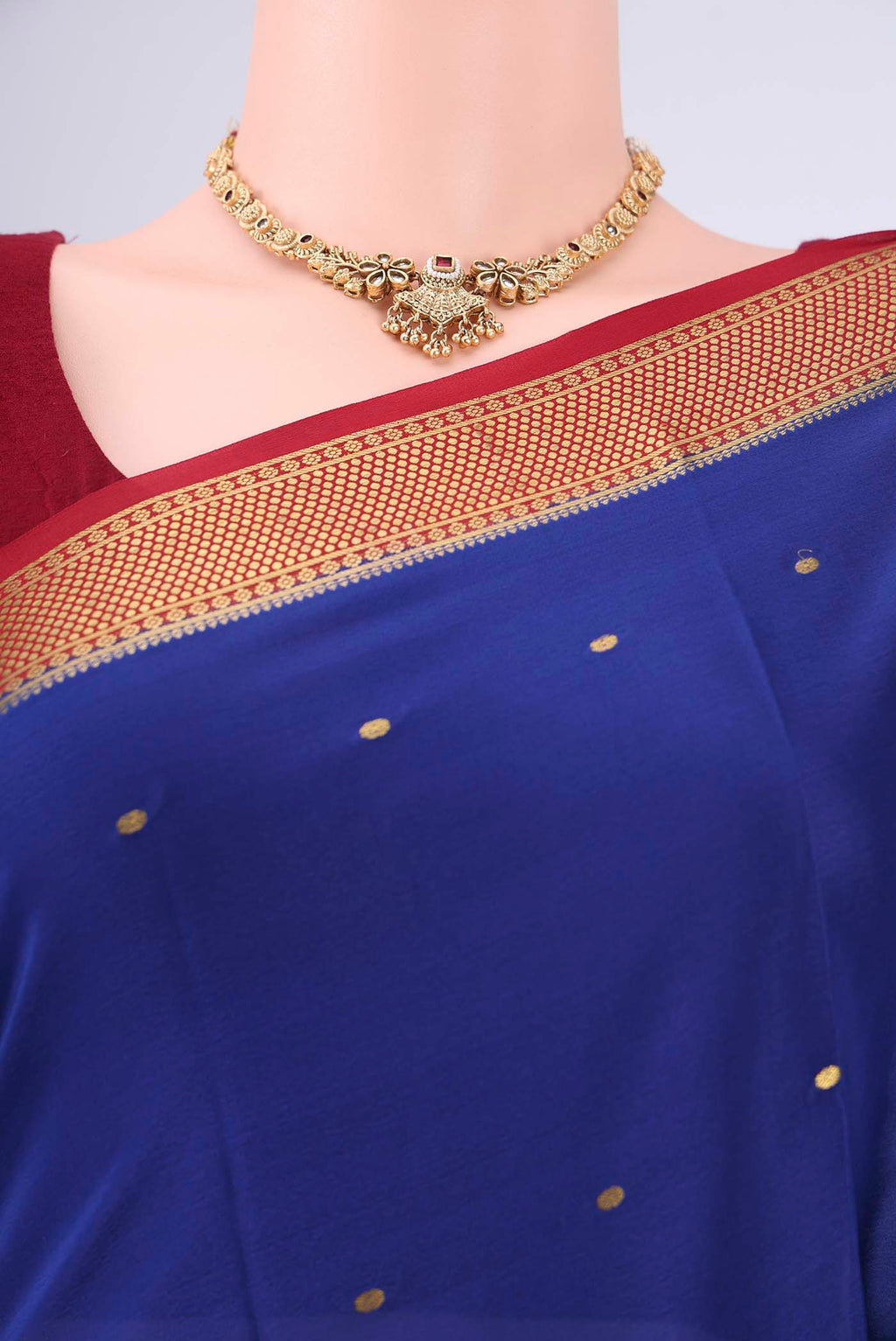 Royal Blue Mysore Georgette Saree with Zari Butta on the body and Zari Border.  displayed on a mannequin