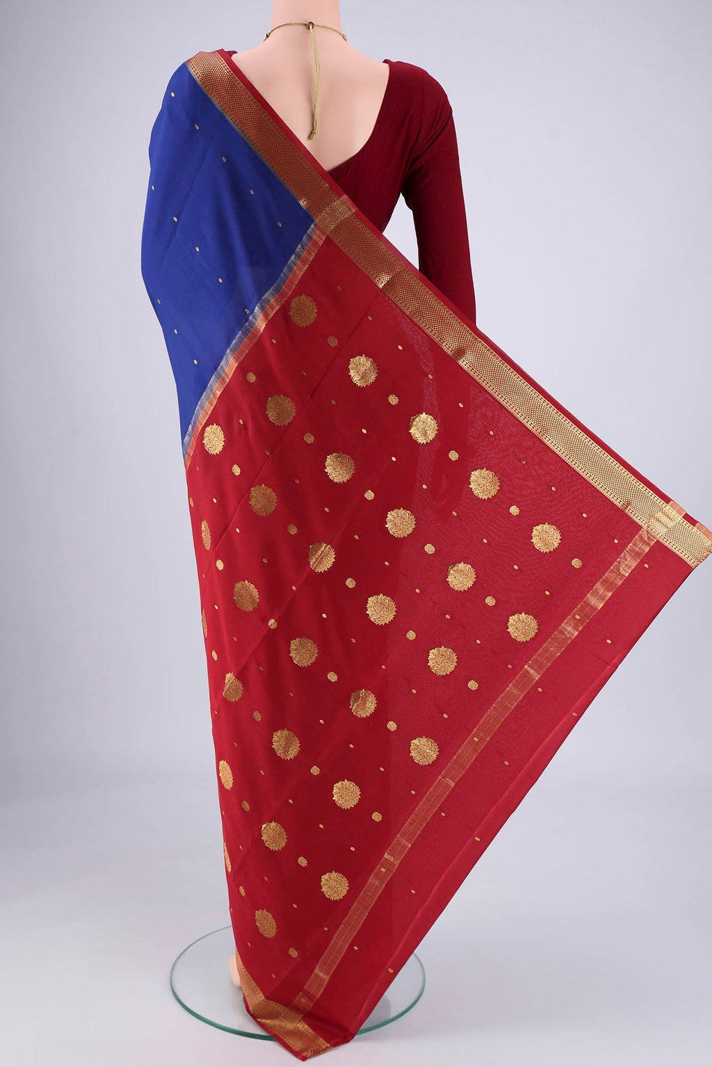 Flat view of Royal Blue Mysore Georgette Saree with Zari Butta on the body and Zari Border. 