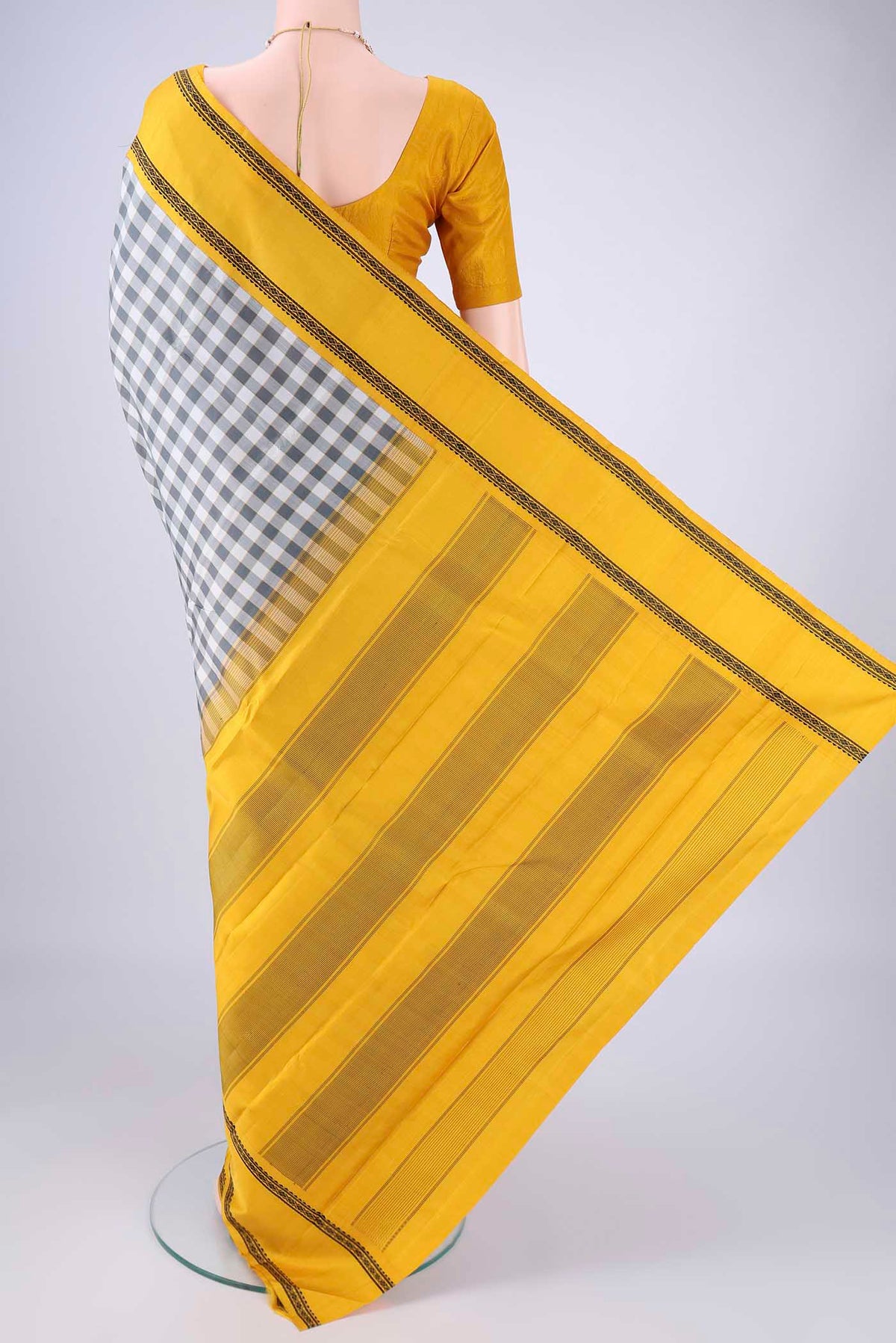 Flat view of Off White Kanjivaram Silk Saree with Checked design on the body and Thread Border. 