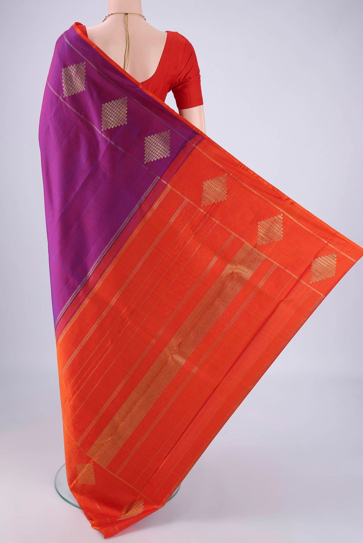 Flat view of Purple Kanchipuram Silk Saree with Plain Body and Without Border. 