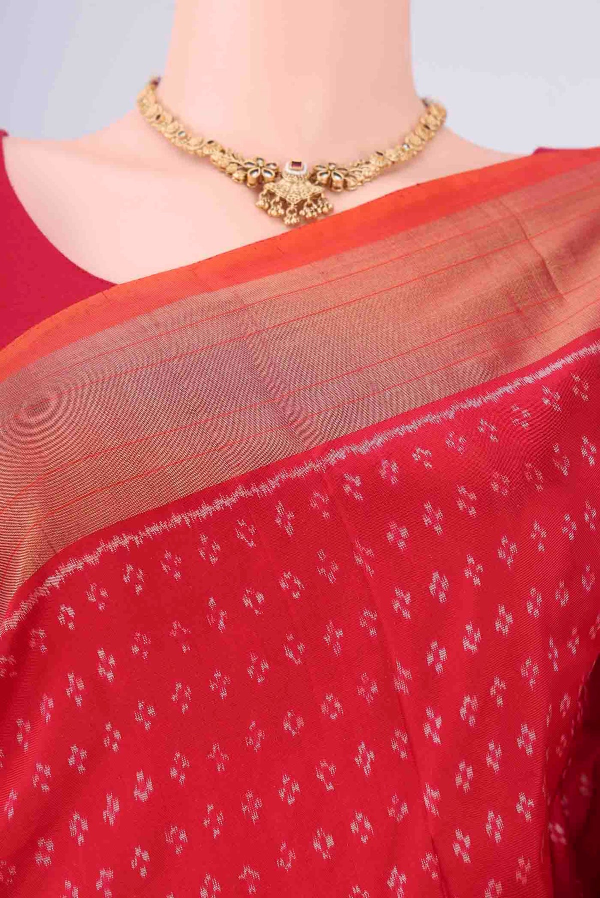 Border image of Red Pochampally Silk Saree with Ikat design on the body and Zari Border. 