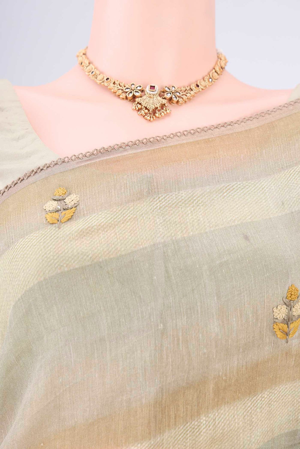 Border image of Sage Green Linen Saree with Embroidery on the body and Lace Border. 