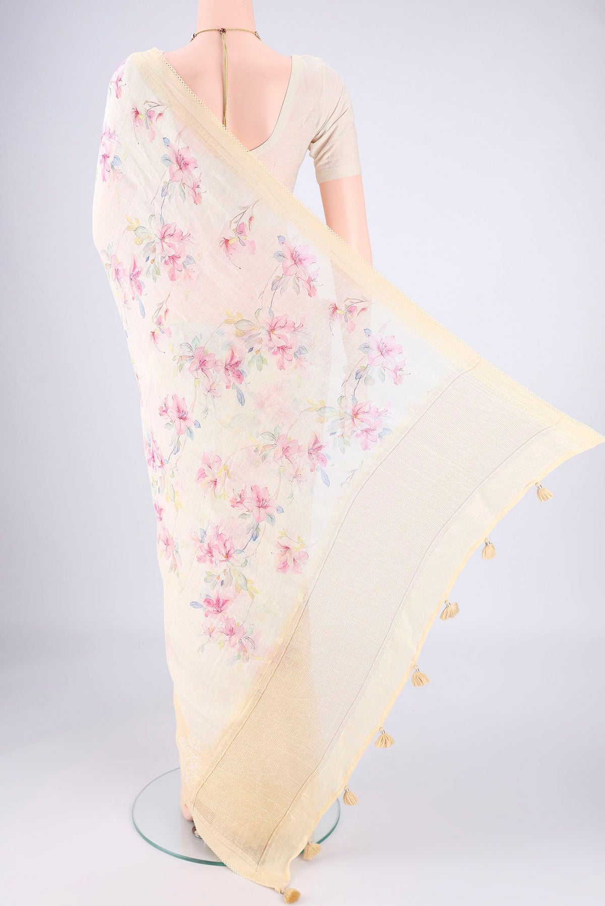 Flat view of Lemon Yellow Linen Saree with Printed design on the body and Lace Border. 
