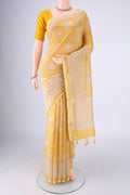 Lemon Yellow Chanderi Silk Cotton Saree with Printed design on the body and Zari And Thread Border.  displayed on a mannequin