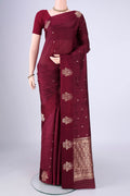 Maroon Banarasi Katan Silk Saree with Zari Butta on the body and Satin Border.  displayed on a mannequin