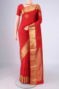 Red Kanchipuram Silk Saree with Zari Butta on the body and Zari Border.  displayed on a mannequin