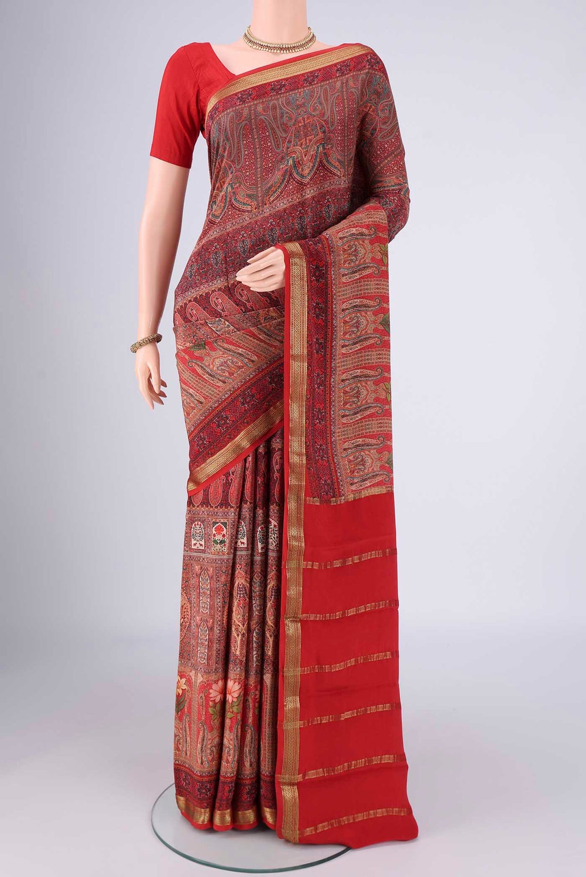 Multi Color Mysore Crepe Saree with Printed design on the body and Zari Border.  displayed on a mannequin