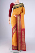Pure Silk Pure Zari Yellow Kanjivaram Saree with Zari Brocade on the body and Ganga Jamuna Border.  displayed on a mannequin