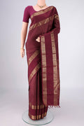 Pure Silk Pure Zari Maroon Kanjivaram Saree with Zari Butta on the body and Zari Border.  displayed on a mannequin