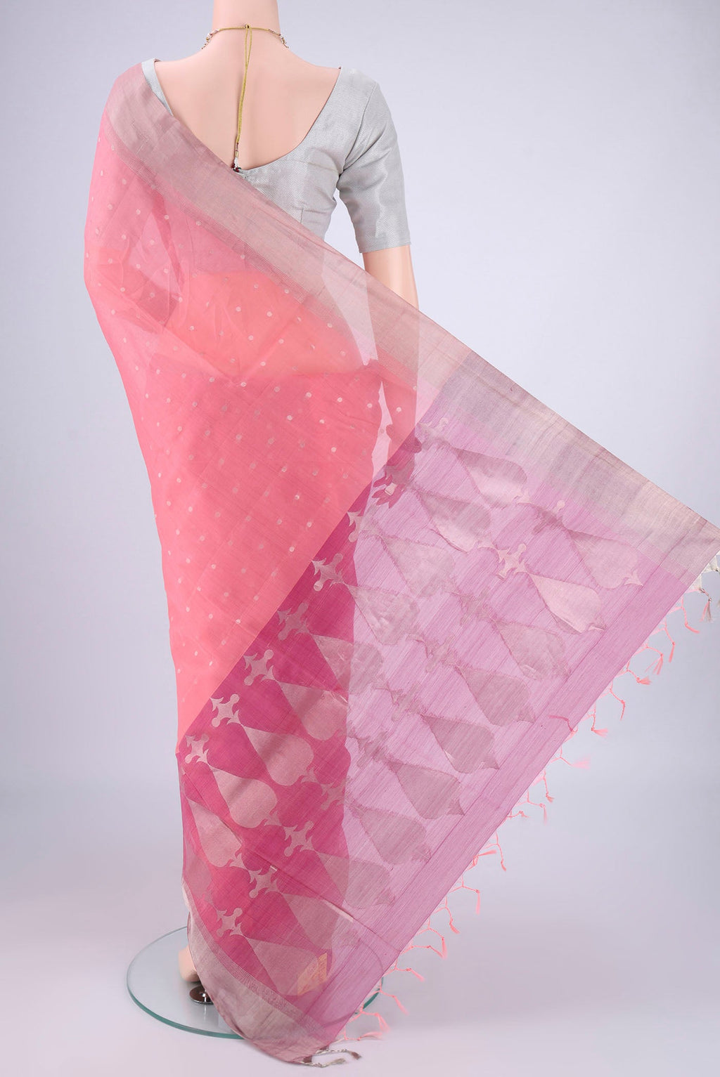 Flat view of Rose pink Silk Cotton Saree with Zari Butta on the body and Zari Border. 