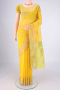Yellow Silk Cotton Saree with Zari Butta on the body and Zari Border.  displayed on a mannequin