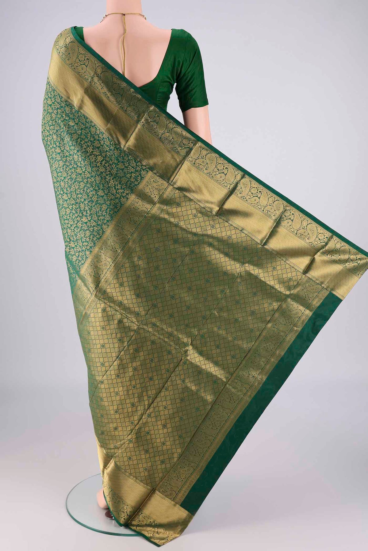 Flat view of Bottle Green Bangalore Silk Saree with Zari Brocade on the body and Zari Border. 