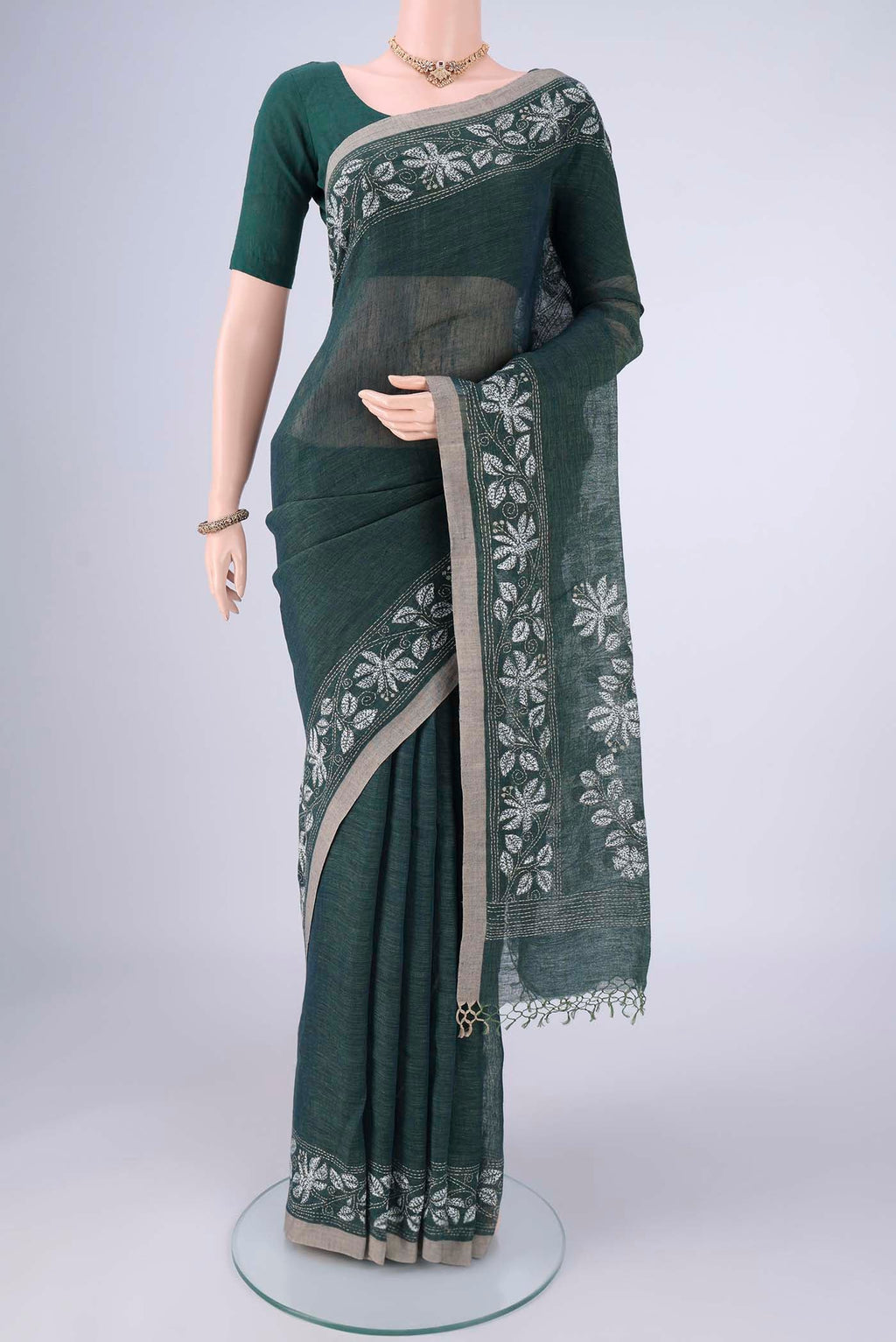 Olive Green Linen Cotton Saree with Kantha Work on the body and Thread Border.  displayed on a mannequin