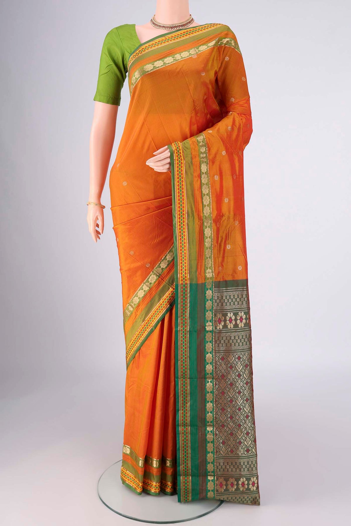 Mustard Blended Bangalore Silk Saree with Zari Butta on the body and Zari Border.  displayed on a mannequin
