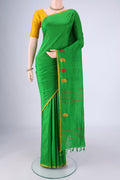 Green Kanchipuram Silk Saree with Plain Body and Thread Border.  displayed on a mannequin