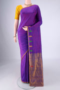 Purple Kanchipuram Silk Saree with Plain Body and Thread Border.  displayed on a mannequin