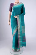 Sea Green Kanchipuram Silk Saree with Plain Body and Thread Border.  displayed on a mannequin