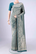 Teal Banarasi Silk Saree with Zari Brocade on the body and Zari Border.  displayed on a mannequin