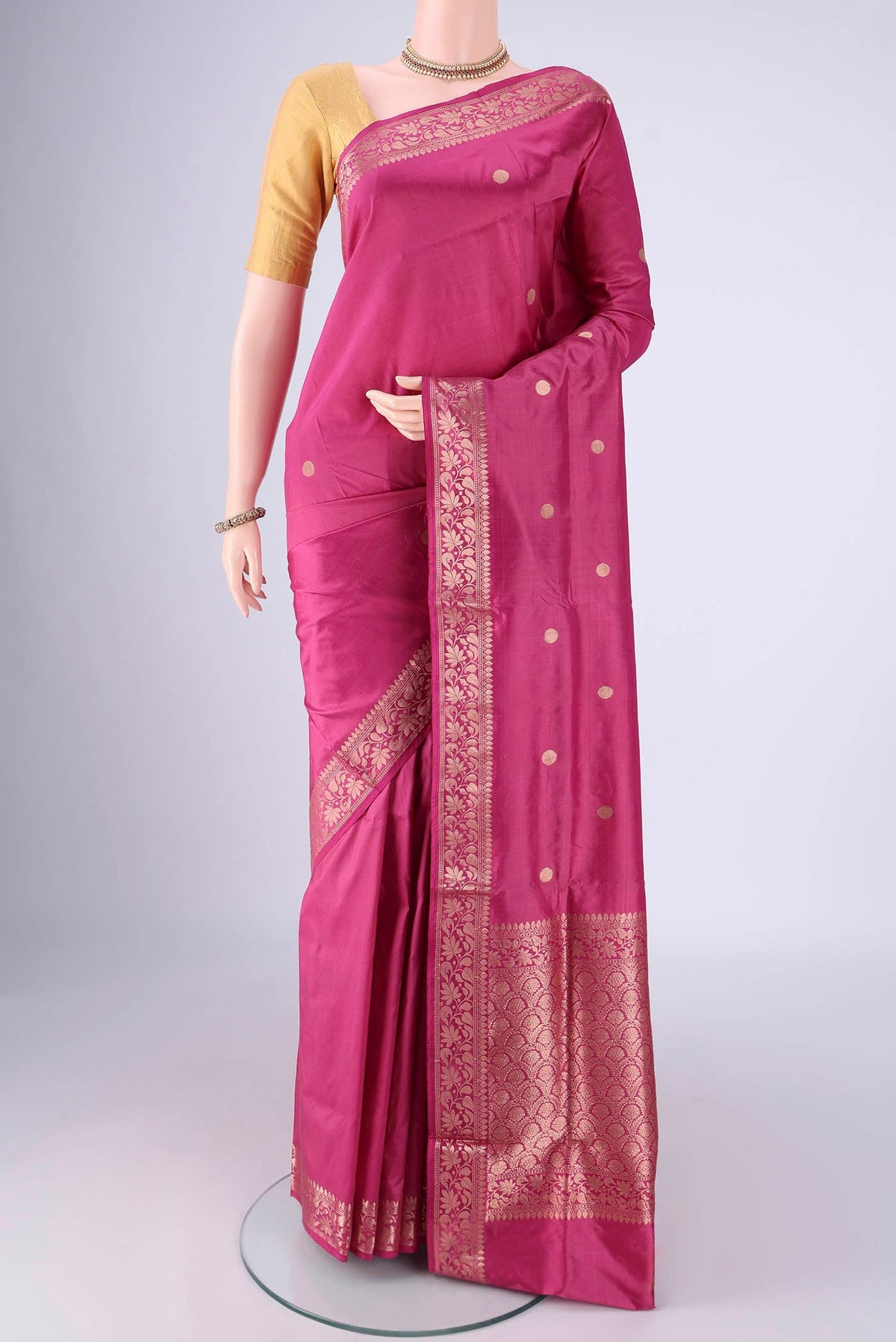 Pink Banarasi Katan Silk Saree with Zari Butta on the body and Zari Border.  displayed on a mannequin