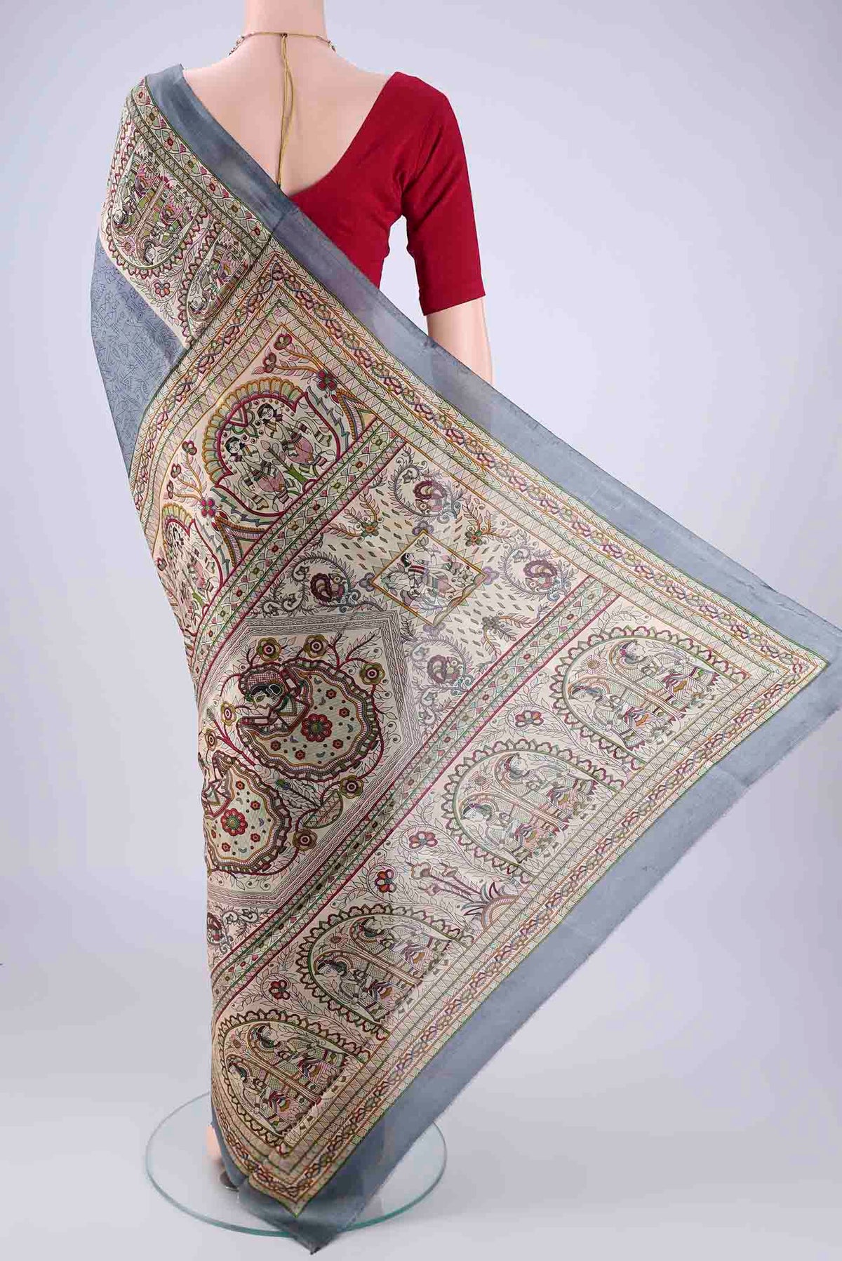 Flat view of Grey Printed Silk Saree with Printed design on the body and Printed Border. 