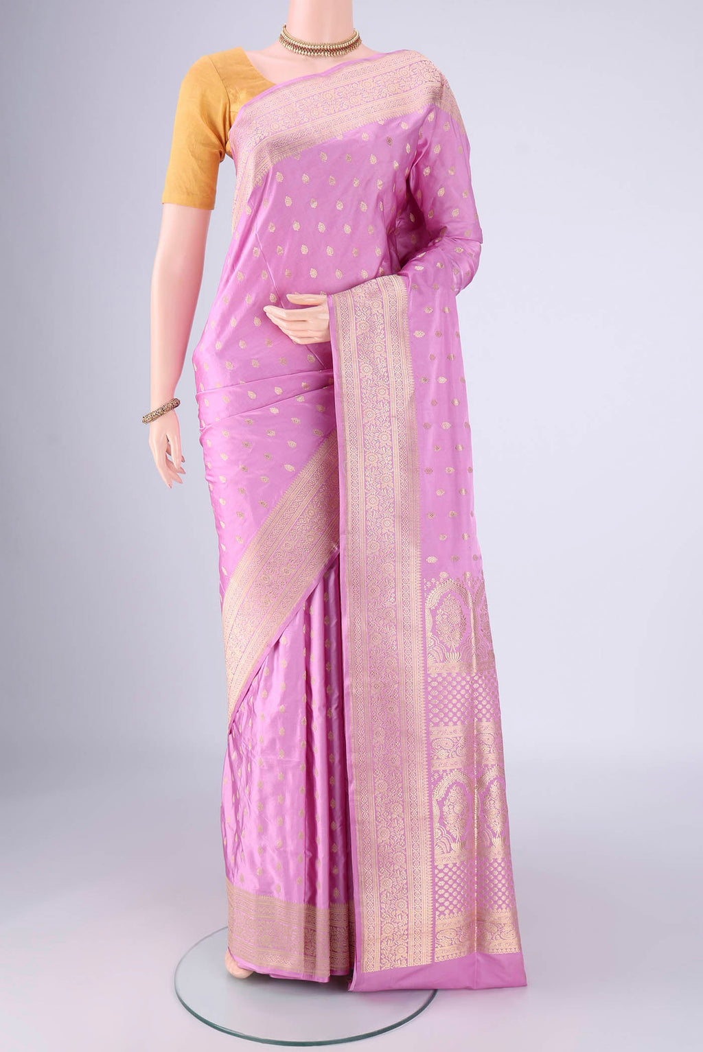 Lilac Banarasi Silk Saree with Zari Butta on the body and Zari Border.  displayed on a mannequin