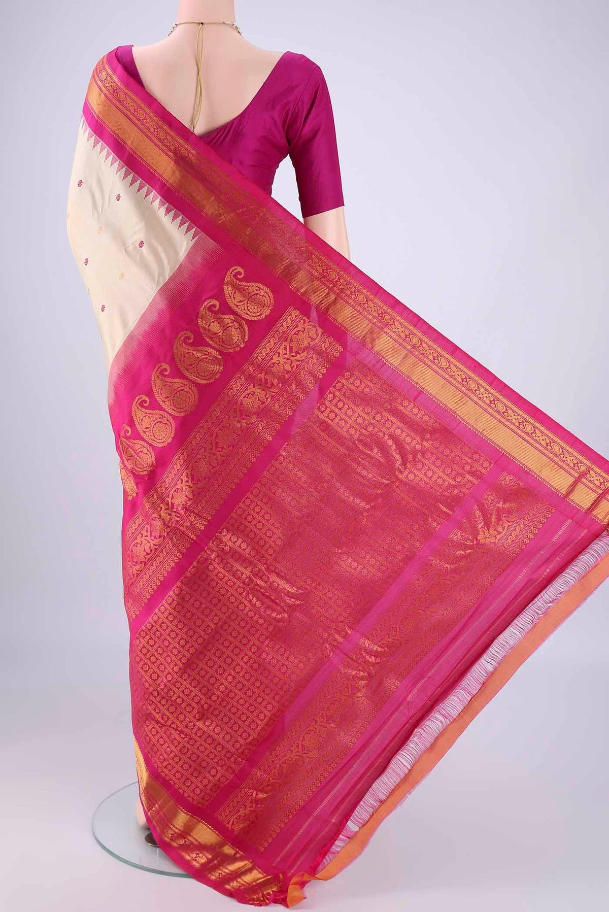 Flat view of Beige Gadwal Silk Saree with Zari And Thread Butta on the body and Zari Border. 