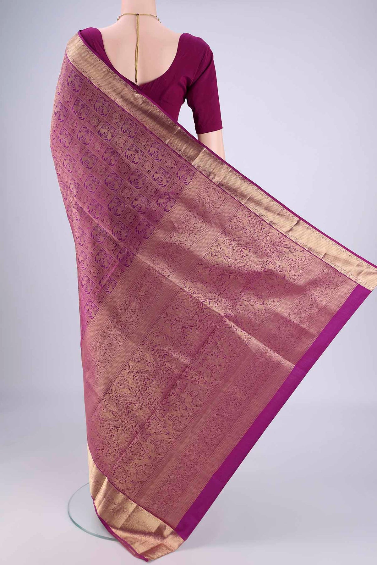Flat view of Purple Soft Silk Saree with Zari Brocade on the body and Zari Border. 