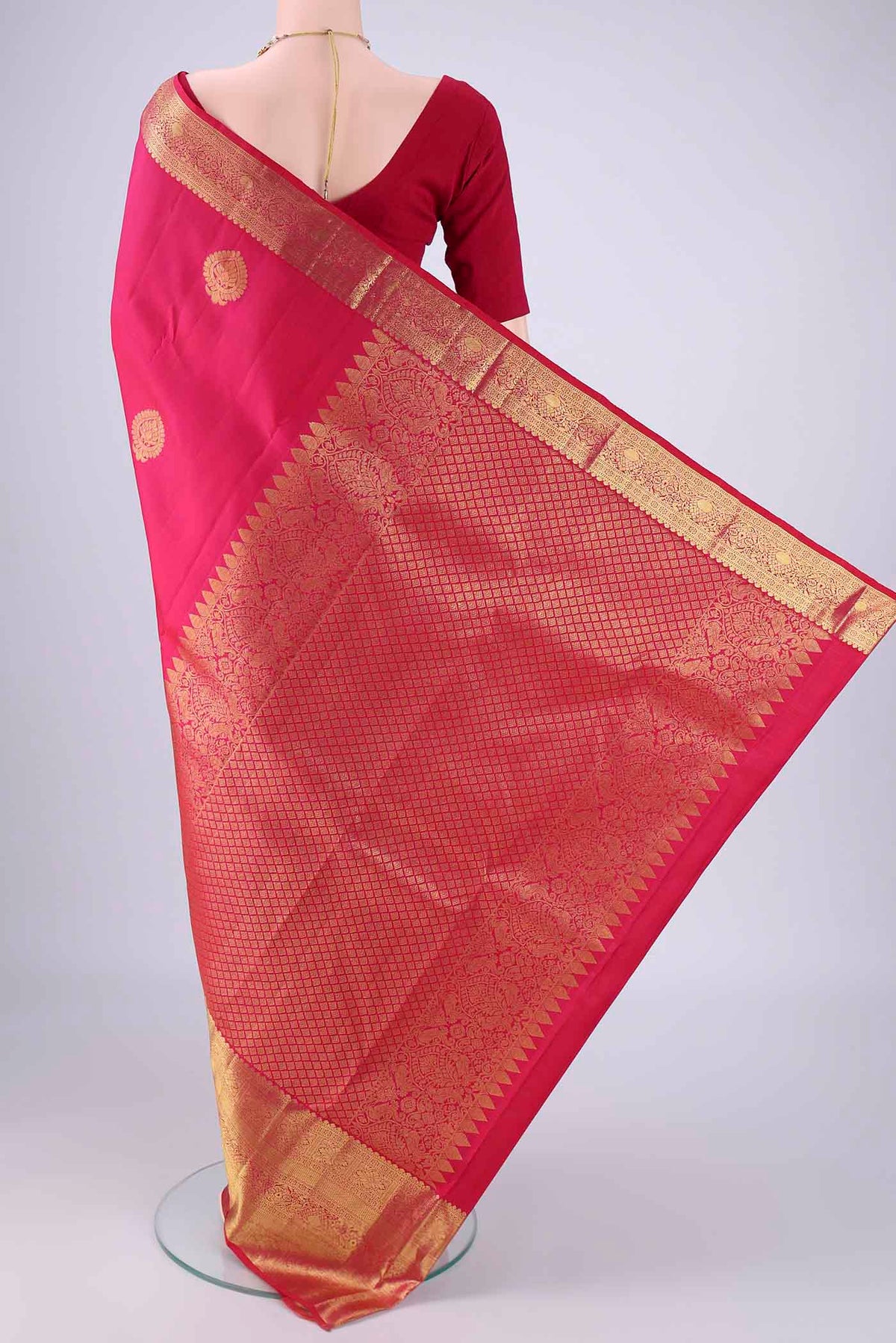 Flat view of Rani Pink Dual Tone Kanchipuram Silk Saree with Zari Butta on the body and Zari Border. 
