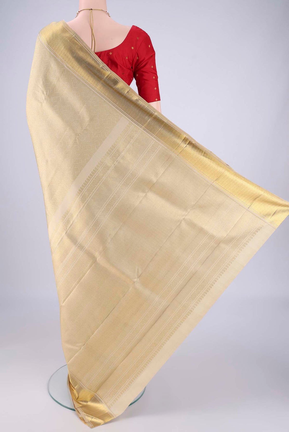 Flat view of Pure Silk Pure Zari Cream Kanjivaram Saree with Zari Brocade on the body and Zari Border. 