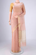 Peach Tussar Silk Saree with Checked design on the body and Zari Border.  displayed on a mannequin